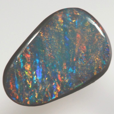 SOLID BLACK OPAL Bands of red and orange over turquoise blue